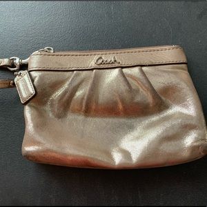 Gentle used - GOLD shimmer Coach wristlet